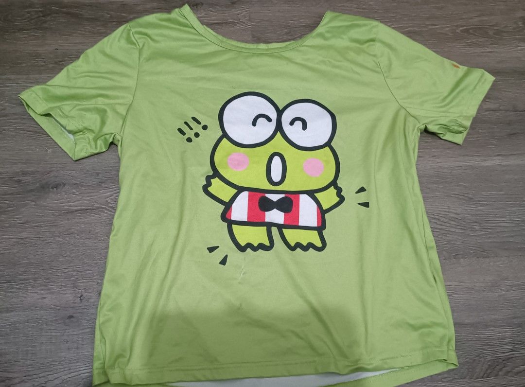 Keroppi sanrio shirt (Category: Shirts) located in Manila. Submitted by vastfish.e9bc58 (Listing ID 1470957815, Image 1). Description: open slit under Keroppi's foot. paint stains on left sleeve.