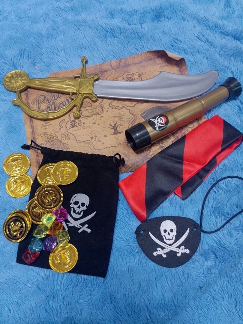 Pirate / Halloween Costume w/ Accessories (Category: Babies & Kids Fashion) located in Pasig City. Submitted by sweetchinchin15 (Listing ID 1471012819, Image 3). Description: - Complete kids pirate costume set: printed skull tunic and striped pants - Includes matching eye patch for the ultimate pirate look - Packed with fun toy accessories: plastic cutlass sword, spyglass telescope, gold coins, colorful gems, and a skull pouch bag - Ideal for Hal