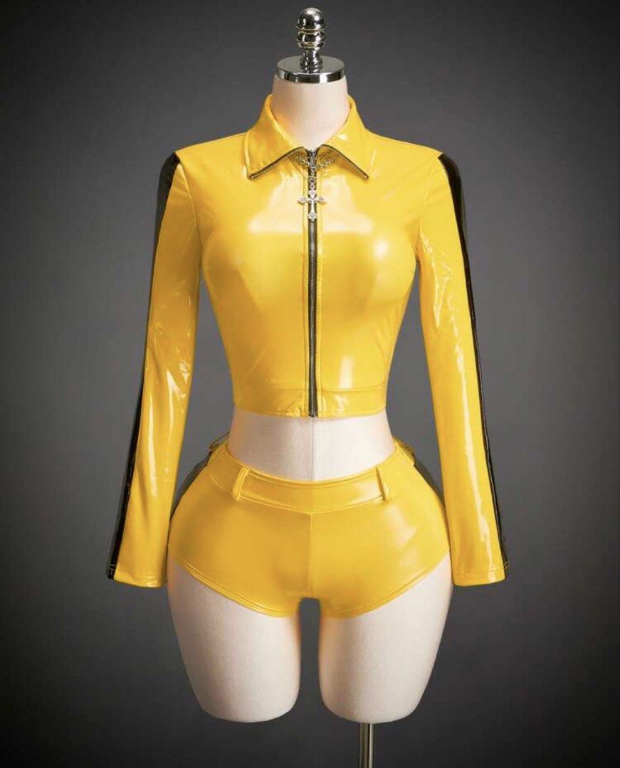 Kill bill costume for rent (Category: Sets or Coordinates) located in Pasig City. Submitted by archivesbym (Listing ID 1471020425, Image 1). Description: - Eye-catching bright yellow glossy faux leather two-piece set - Bold black racing stripes running down sleeves and sides - Cropped zip-up jacket with a pointed collar and unique silver cross zipper pull - Matching high-waisted booty shorts equipped with belt loops - Ideal outfit for costume par