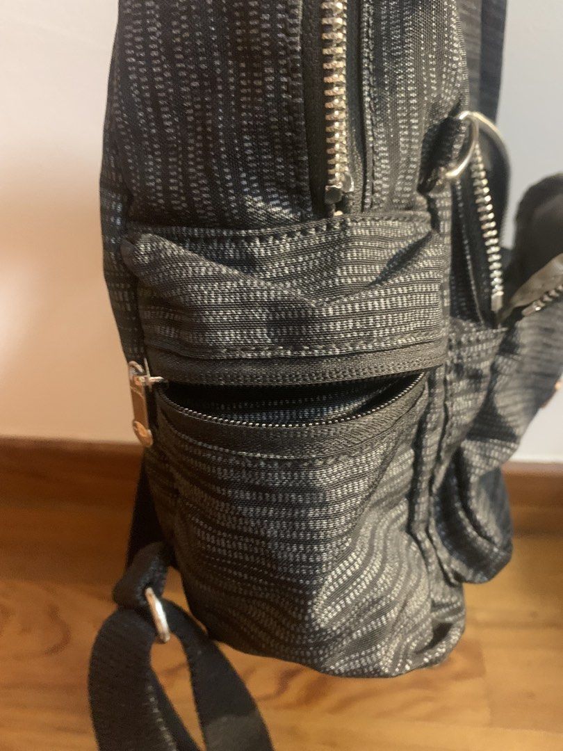Kipling Black Patterned Mini Backpack (Category: Backpacks) located in Singapore. Submitted by luke81638 (Listing ID 1471037860, Image 6). Description: Details: - small backpack w 4 compartments - clean interior Condition: 9/10 - no visible damages Payment: cash or paynow.