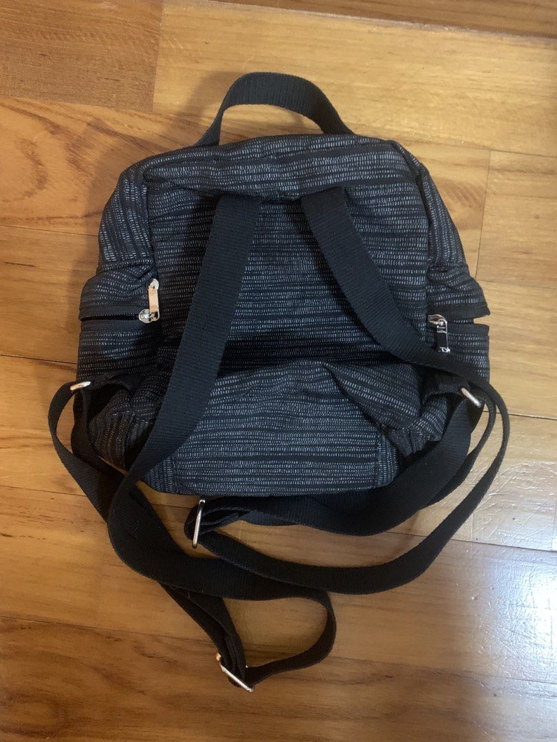 Kipling Black Patterned Mini Backpack (Category: Backpacks) located in Singapore. Submitted by luke81638 (Listing ID 1471037860, Image 2). Description: Details: - small backpack w 4 compartments - clean interior Condition: 9/10 - no visible damages Payment: cash or paynow.