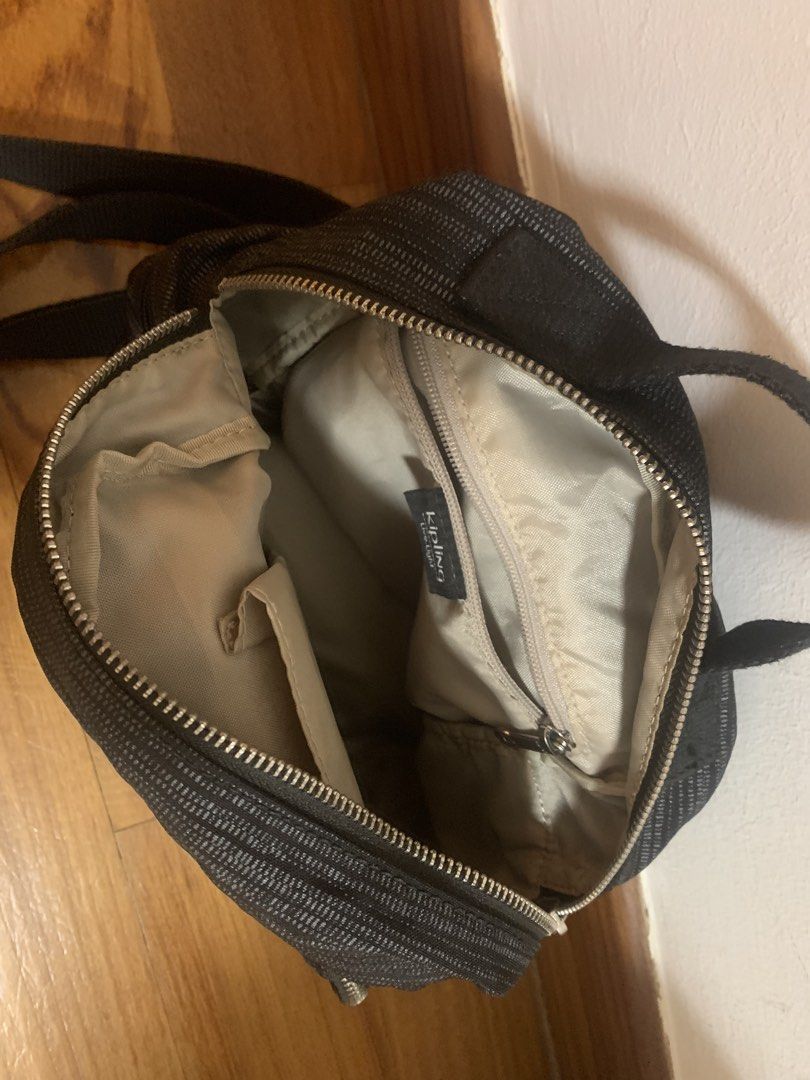 Kipling Black Patterned Mini Backpack (Category: Backpacks) located in Singapore. Submitted by luke81638 (Listing ID 1471037860, Image 3). Description: Details: - small backpack w 4 compartments - clean interior Condition: 9/10 - no visible damages Payment: cash or paynow.