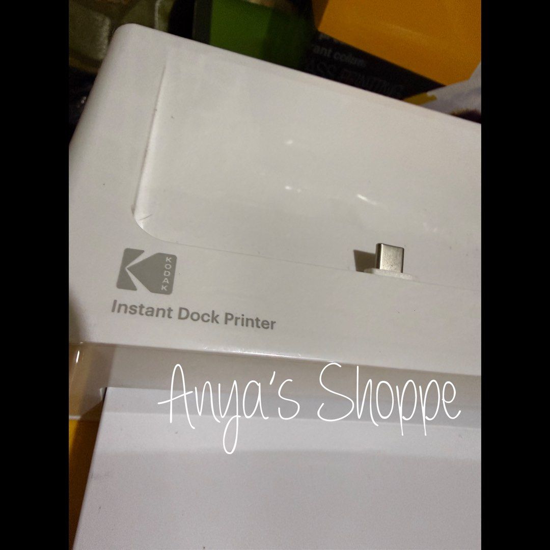 Kodak Instant Dock Printer (Category: Printers, Scanners & Copiers) located in Paranaque City. Submitted by anyasshoppe (Listing ID 1470947447, Image 2). Description: - Model: Kodak Instant Dock Printer PD460 (White with yellow packaging) - Print Size: 4x6 inches directly from your smartphone - Condition: Complete set in original box - Inclusions: Power adapter, quick guide manual, lightning adapter, and free 1 brand new cartridge & 40 Photo Pape