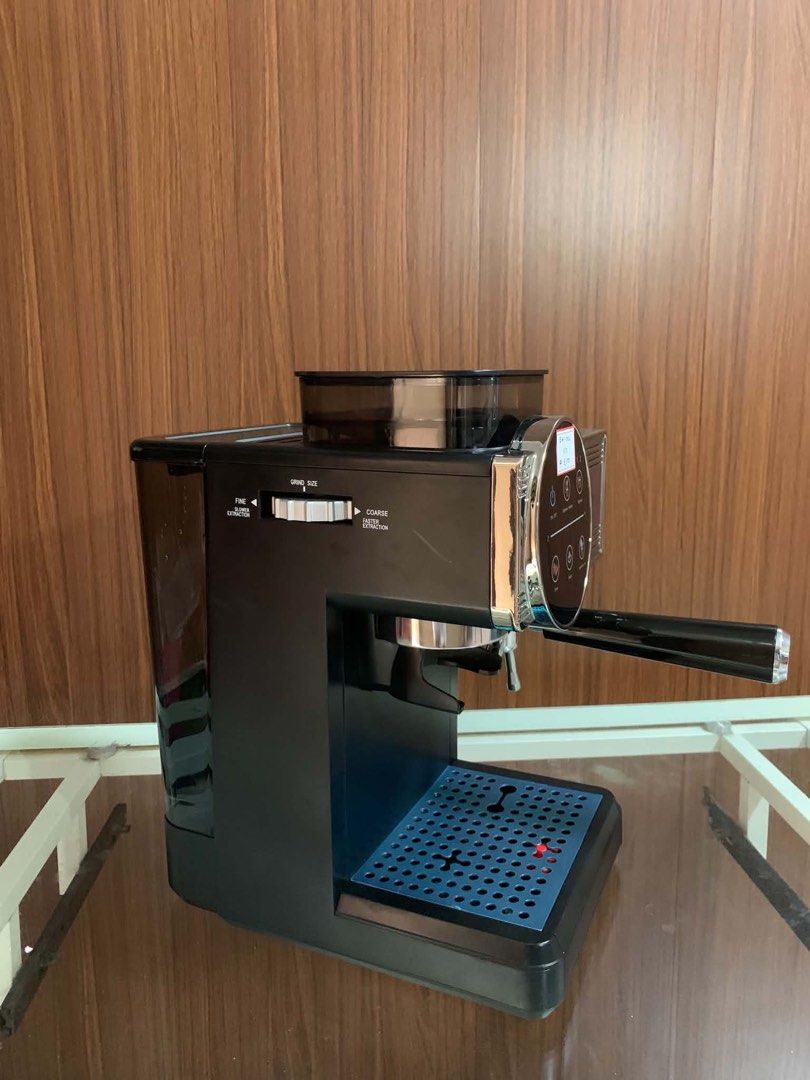 Kogan Espresso Machine with Built-in Grinder EMF-1026 (Category: Coffee Machines & Makers) located in Pulilan. Submitted by sebbii (Listing ID 1470964182, Image 2). Description: - Model: Kogan EMF-1026 Espresso Machine - Finish: Clean black and chrome with a stylish blue drip tray - Built-in bean hopper with side-adjustable grind size settings - Digital touch control panel for easy heating, steam, and shot extraction - Includes portafilter, built