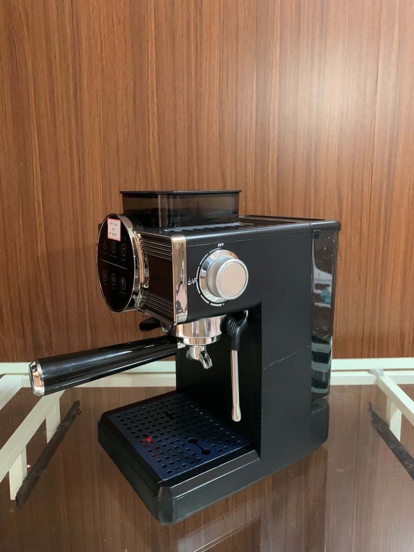Kogan Espresso Machine with Built-in Grinder EMF-1026 (Category: Coffee Machines & Makers) located in Pulilan. Submitted by sebbii (Listing ID 1470964182, Image 3). Description: - Model: Kogan EMF-1026 Espresso Machine - Finish: Clean black and chrome with a stylish blue drip tray - Built-in bean hopper with side-adjustable grind size settings - Digital touch control panel for easy heating, steam, and shot extraction - Includes portafilter, built