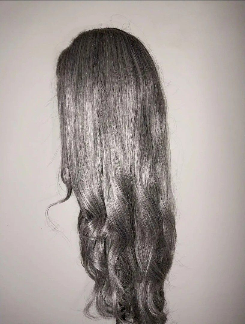 Lace front wig synthetic (Category: Hair) located in Davao. Submitted by dollcollector495 (Listing ID 1471090171, Image 1). Description: 13x6 33 inches long - Color: Medium ash grey tone - Style: Long curly wig with soft, flowing waves - Construction: Lace front with natural-looking parting space - Fit: Adjustable .