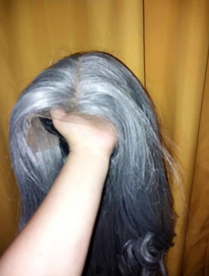 Lace front wig synthetic (Category: Hair) located in Davao. Submitted by dollcollector495 (Listing ID 1471090171, Image 3). Description: 13x6 33 inches long - Color: Medium ash grey tone - Style: Long curly wig with soft, flowing waves - Construction: Lace front with natural-looking parting space - Fit: Adjustable .