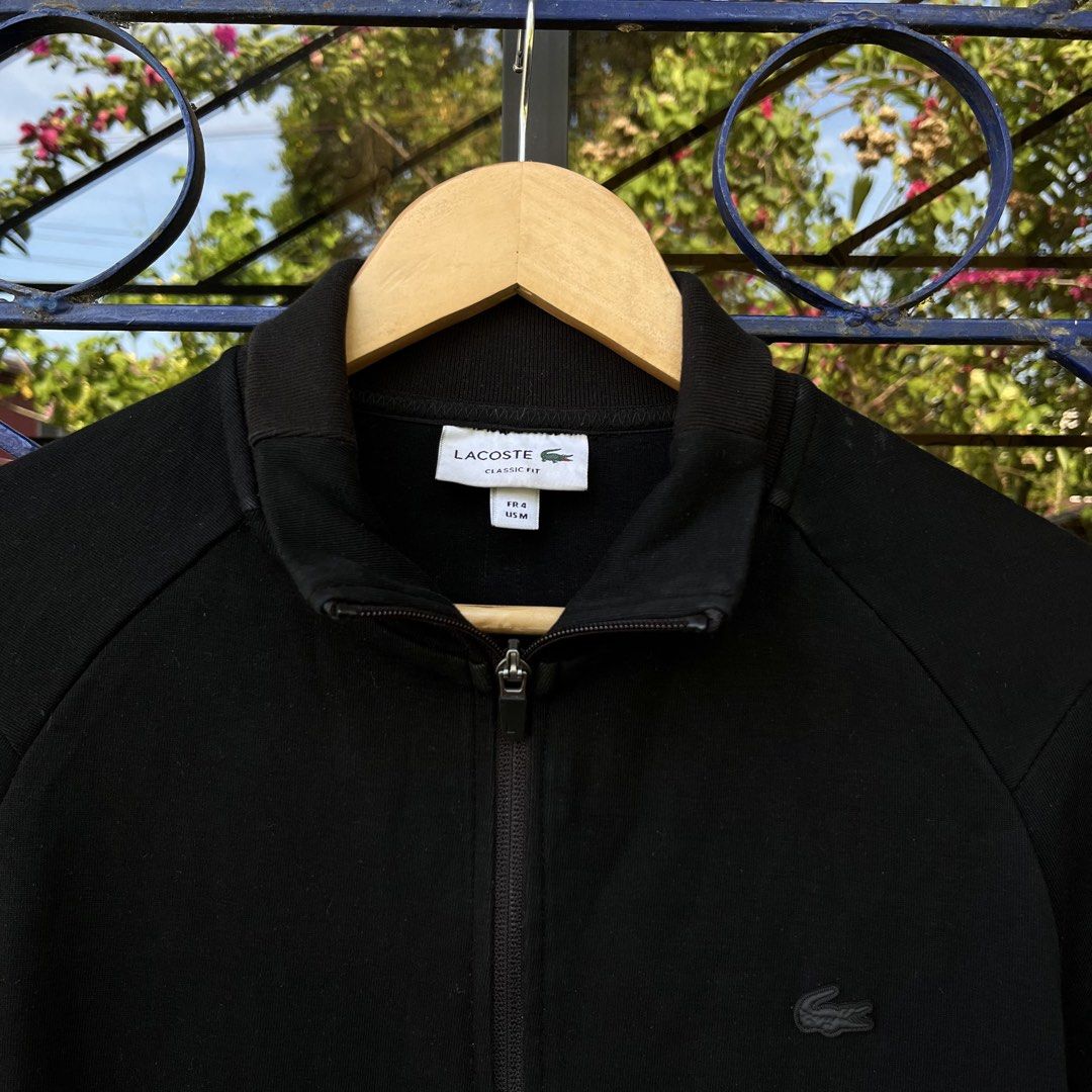 Lacoste Black Full Zip Classic Fit Track Jacket (Category: Coats, Jackets and Outerwear) located in Davao. Submitted by streetsight (Listing ID 1471020386, Image 2). Description: - Brand: Lacoste - Style: Full-zip jacket in classic fit - Size: FR 4 / US Medium - Color: Solid black with tonal black crocodile logo - Details: High collar, front pockets, ribbed hem and cuffs - Condition: Clean piece, perfect everyday basic.