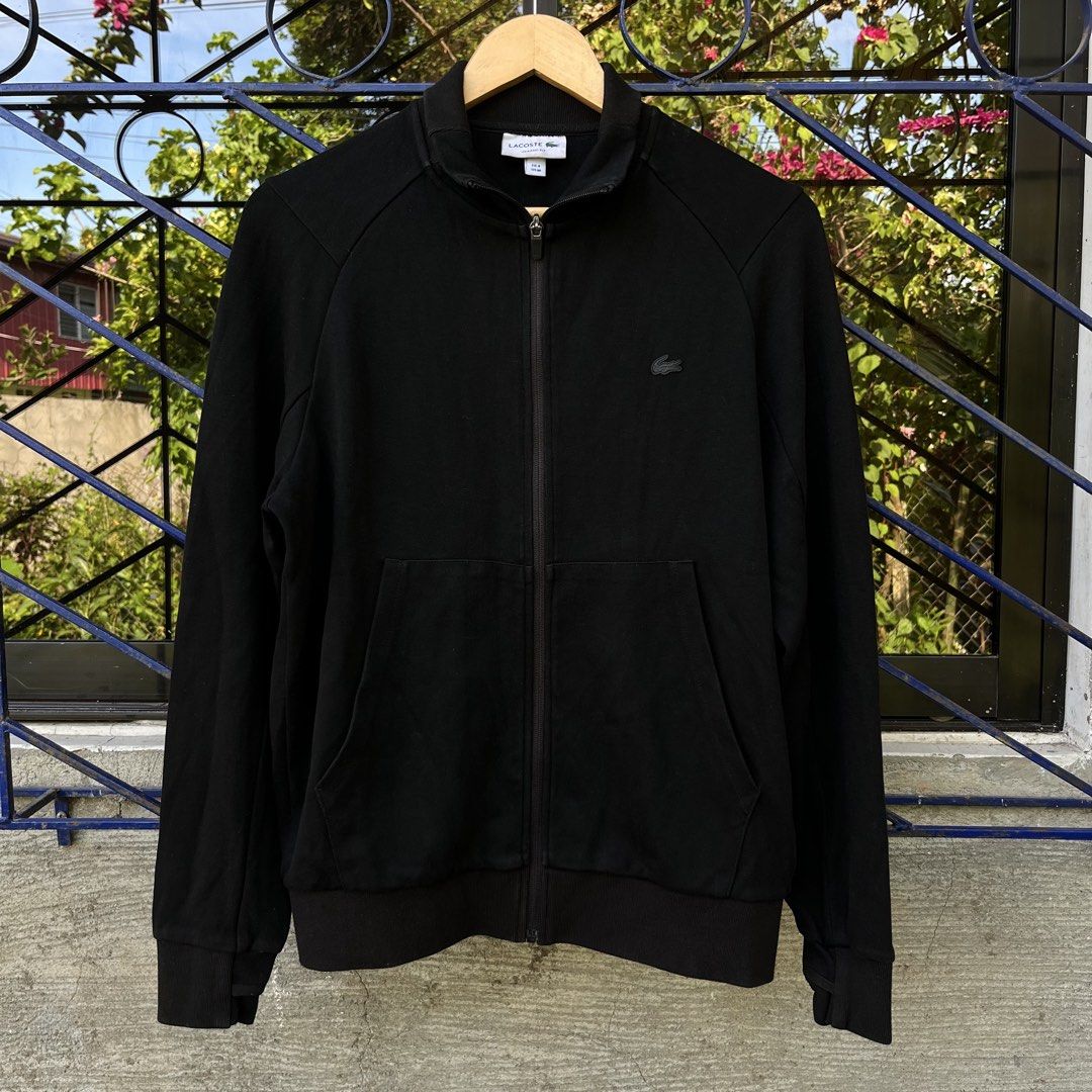 Lacoste Black Full Zip Classic Fit Track Jacket (Category: Coats, Jackets and Outerwear) located in Davao. Submitted by streetsight (Listing ID 1471020386, Image 1). Description: - Brand: Lacoste - Style: Full-zip jacket in classic fit - Size: FR 4 / US Medium - Color: Solid black with tonal black crocodile logo - Details: High collar, front pockets, ribbed hem and cuffs - Condition: Clean piece, perfect everyday basic.
