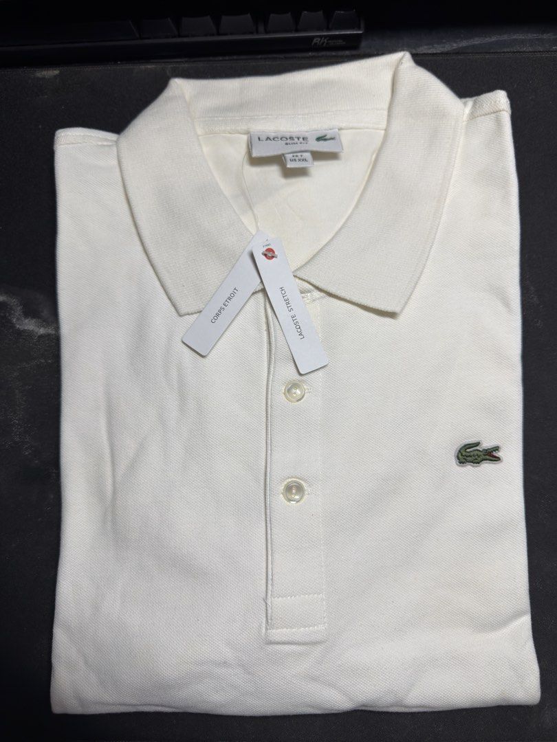 Lacoste Polo Shirt - Bnew (Category: Tshirts & Polo Shirts ) located in Manila. Submitted by tindero-ng-damit (Listing ID 1471078519, Image 3). Description: Name: LACOSTE Polo shirt - Bnew Slim fit - Pique Stretch Size 7 FR - XXL US but fits XL since its a slim fit variant Width 23 X Length 29 Never Been worn - BNEW SEALED 2800 only retails at ₱5990 in stores.