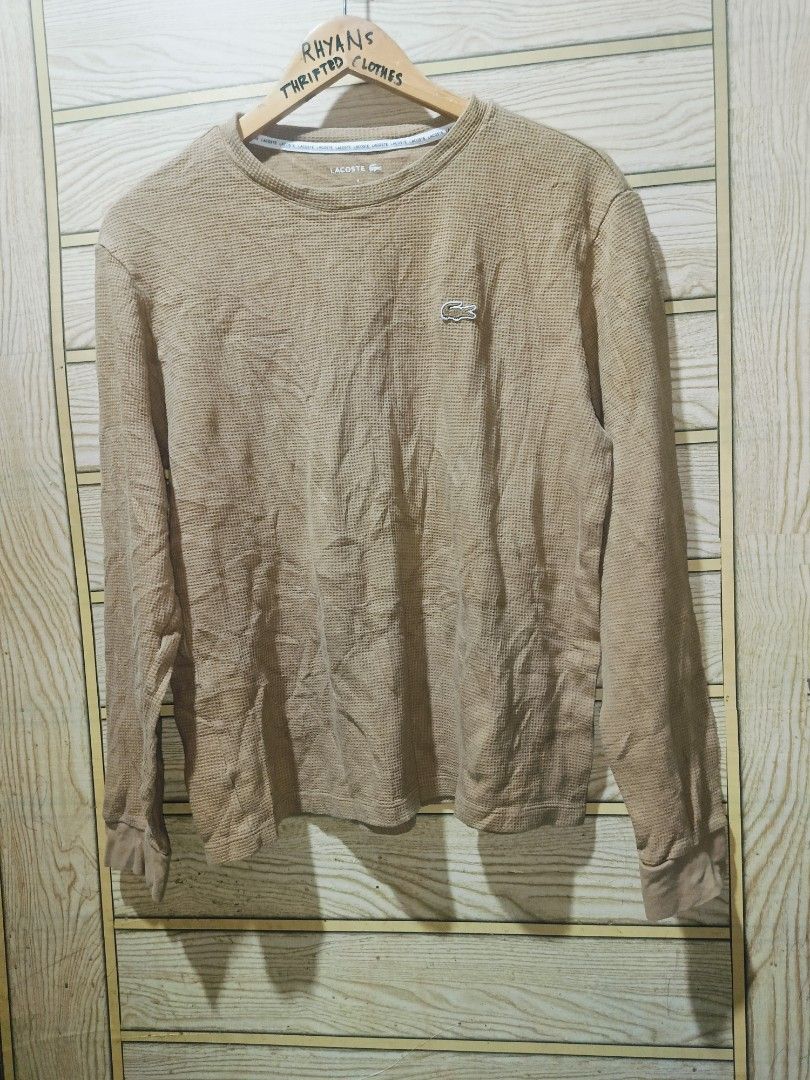 Lacoste Waffle Knit Long Sleeve Sweater Tan Medium (Category: Coats, Jackets and Outerwear) located in Narra. Submitted by rhyanguan63087 (Listing ID 1471006457, Image 3). Description: - Brand Lacoste - Style Waffle knit long sleeve top - Color Tan - Size Medium 20x24.5 dimension - Details: Round neckline with branded interior tape trim, iconic embroidered crocodile logo patch on chest, ribbed cuffs and hem - Condition: Excellent pre-loved condit