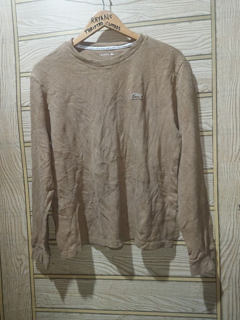 Lacoste Waffle Knit Long Sleeve Sweater Tan Medium (Category: Coats, Jackets and Outerwear) located in Narra. Submitted by rhyanguan63087 (Listing ID 1471006457, Image 2). Description: - Brand Lacoste - Style Waffle knit long sleeve top - Color Tan - Size Medium 20x24.5 dimension - Details: Round neckline with branded interior tape trim, iconic embroidered crocodile logo patch on chest, ribbed cuffs and hem - Condition: Excellent pre-loved condit