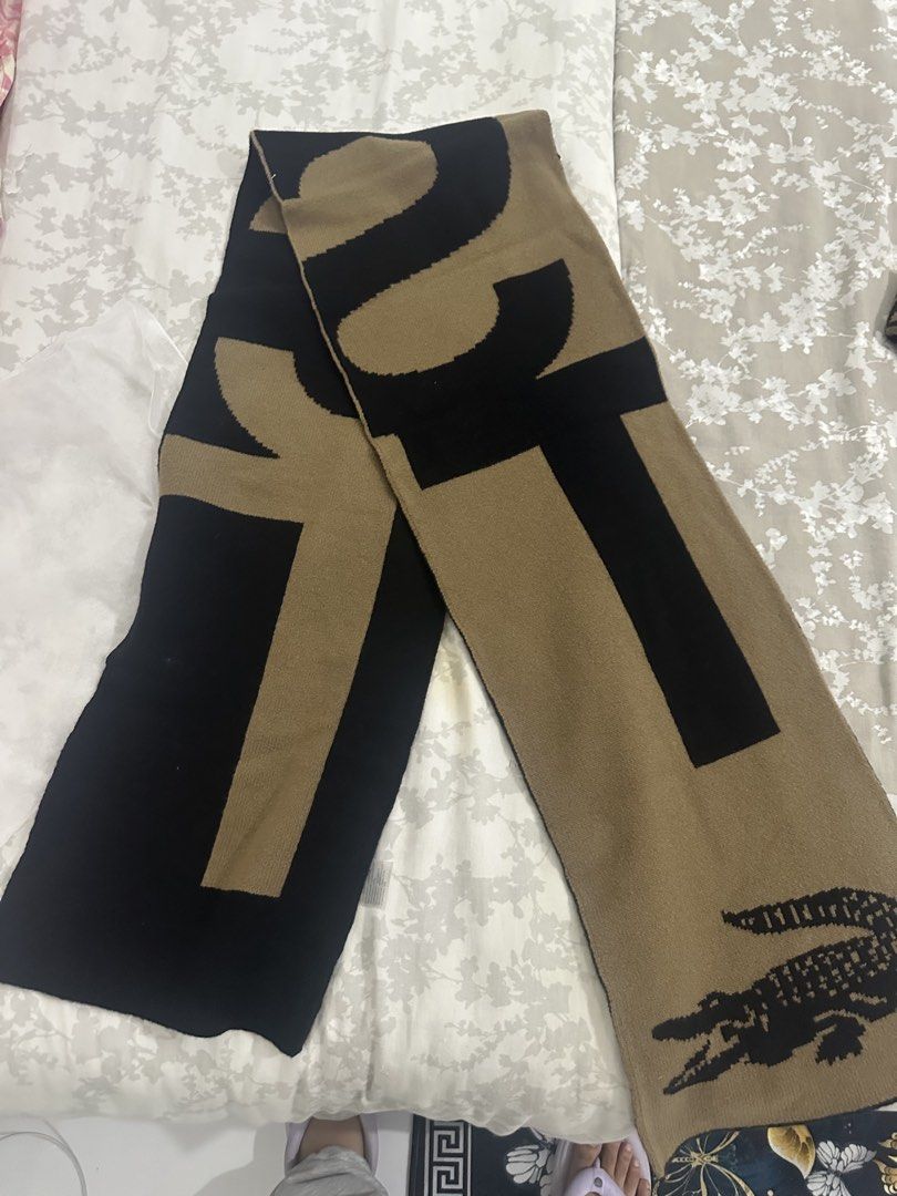 Lacoste Wool Scarf and Beanie Set Brown Black (Category: Scarves) located in Quezon City. Submitted by _samanthajyc (Listing ID 1471061403, Image 3). Description: - Brand: Lacoste - Set: Matching scarf and beanie combo - Colorway: Brown and black with large branding text and classic croc logo - Material: 100% wool, super warm for cold weather - Size: Unisex, one size fits all - Condition: Brand new with clean tags attached inside.
