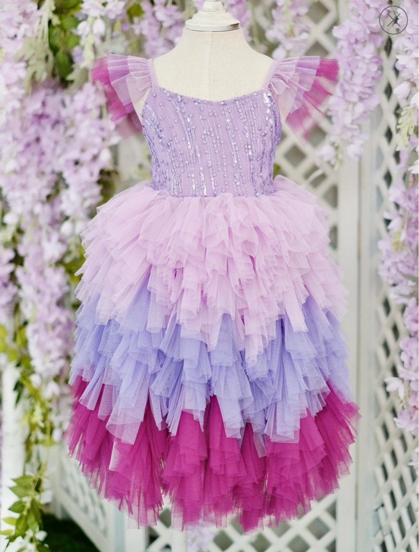 Laila and Lyra Laurette Size 4 (Category: Babies & Kids Fashion) located in Daraga. Submitted by iamsupershein (Listing ID 1470938752, Image 1). Description: - Stunning ombre tulle dress with lavender, lilac, and vibrant magenta tiers - Sleeves feature cute ruffled tulle detailing - Bodice is fully covered in shimmering vertical sequin stripes and beading - Designed with a classic scoop neckline and structured fit - Ideal statement piece for birt