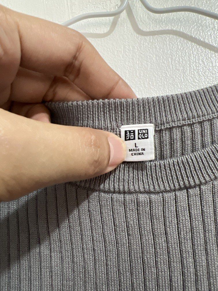 Large Uniqlo dark gray knitted top (Category: Others Tops) located in Las Pinas. Submitted by gaeley (Listing ID 1470952030, Image 3). Description: L on tag b: 15" armpit to armpit l: 21" .