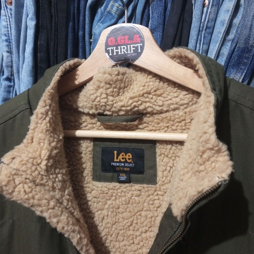 Lee Sherpa Lined Canvas Workwear Vest (Category: Vests) located in Cabuyao City. Submitted by o.gl.athrift (Listing ID 1471051336, Image 2). Description: Lee Sherpa Lined Canvas Workwear Vest *olive green color way * XXL on tag * Manufactured in China 28 Inches width (pit to pit measurements) 30.5 Inches length Condition: Like new Color rate: 10/10 Issue/s: None Mine: 499+SF Color may vary due to lightning Location : Cabuyao Laguna Unli vouch and