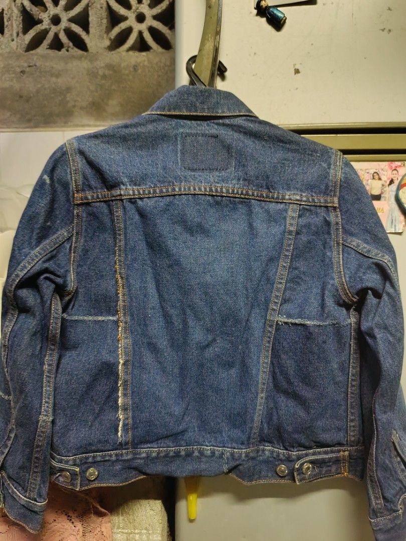 Levi Strauss & Co. Denim Jacket Size S (Category: Coats, Jackets and Outerwear) located in Manila. Submitted by katrina.who (Listing ID 1471024361, Image 3). Description: - Brand: Levi's - Style: Classic denim jacket (Model 57511) - Wash: Dark blue with striking orange contrast stitching - Size: Small - Closures: Metal button front - Pockets: Two button-flap chest pockets and convenient vertical side pockets - Details: Features traditional tan le