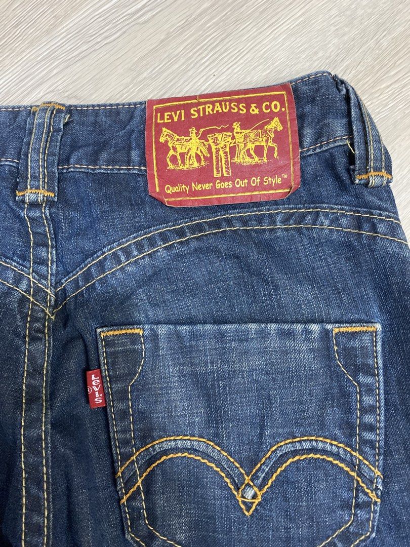 Levi Strauss & Co. Denim Jeans (Category: Jeans) located in Caloocan City. Submitted by heatedcaps4425 (Listing ID 1471099055, Image 3). Description: - Brand: Levi's - Style: Straight leg, classic 5-pocket design with belt loops - Color/Wash: Dark wash with contrast orange stitching - Details: Iconic red tab and 'Quality Never Goes Out Of Style' red leather-style back patch - Condition: Great for everyday wear.