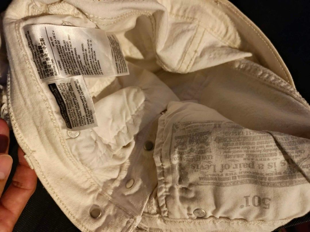 Levi's 501 White Distressed Denim Shorts (Category: Shorts) located in Davao. Submitted by romelyap (Listing ID 1471004583, Image 2). Description: - Brand: Levi's (501 Line) Waistline 28 to 30 - Color: White - Style: High-waisted denim shorts with button fly - Details: Distressed front, raw frayed hems, classic 5-pocket design - Condition: Great pre-loved condition with original tags intact - Perfect for: Casual OOTDs and summer beach trips.