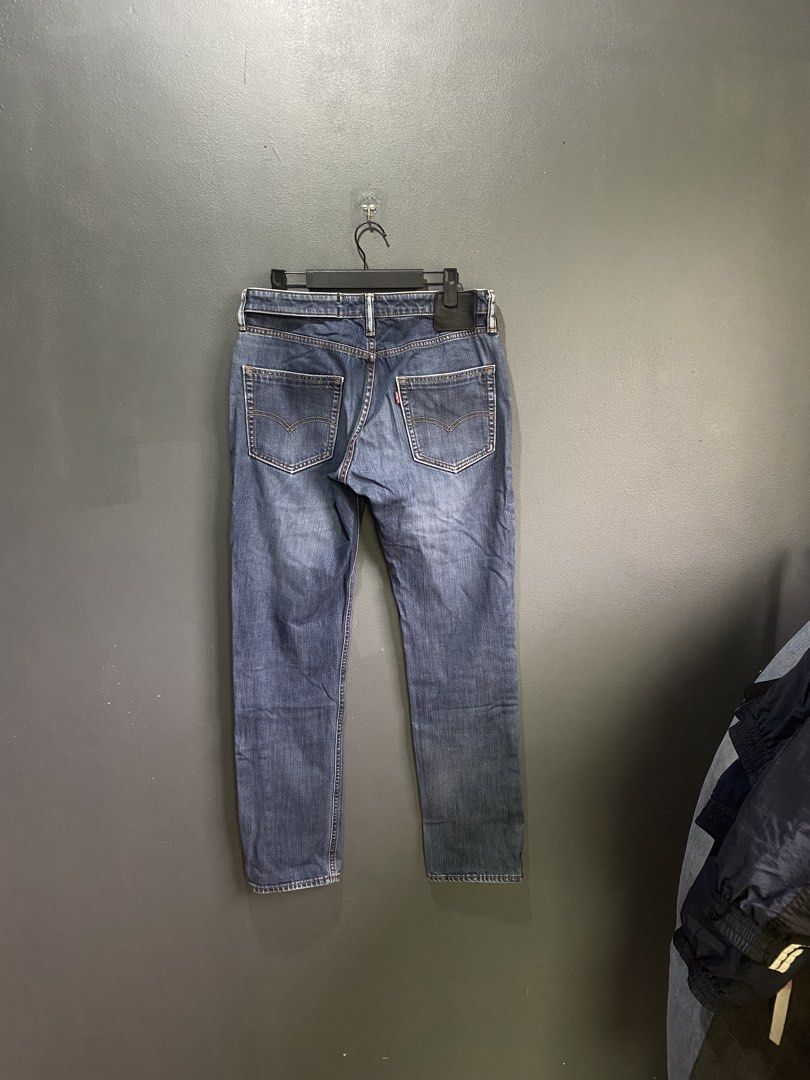 Levi's 511 (Category: Jeans) located in Lucena. Submitted by handpickthrift (Listing ID 1470933577, Image 2). Description: - Brand: Levi's 511 Size 32 - Wash: Dark wash with a stylish faded finish - Fit: Straight fit, mid-rise cut for all-day comfort - Design: Traditional 5-pocket styling with contrast stitching - Details: Zip fly with button closure, signature red tab, and black leather waistband patch - Condition: Great everyday denim piece, re