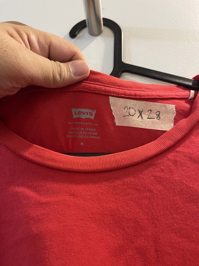 Levi's Red Yellow Logo T-Shirt Medium (Category: Tshirts & Polo Shirts ) located in San Fernando. Submitted by bondocmac42825 (Listing ID 1470964503, Image 3). Description: - Brand: Levi's - Color: Red with bold yellow chest logo - Material: 100% Cotton - Size: Medium - Fit/Style: Standard crew neck with straight hem and iconic red tab detail - Fast shipping and trusted seller!.