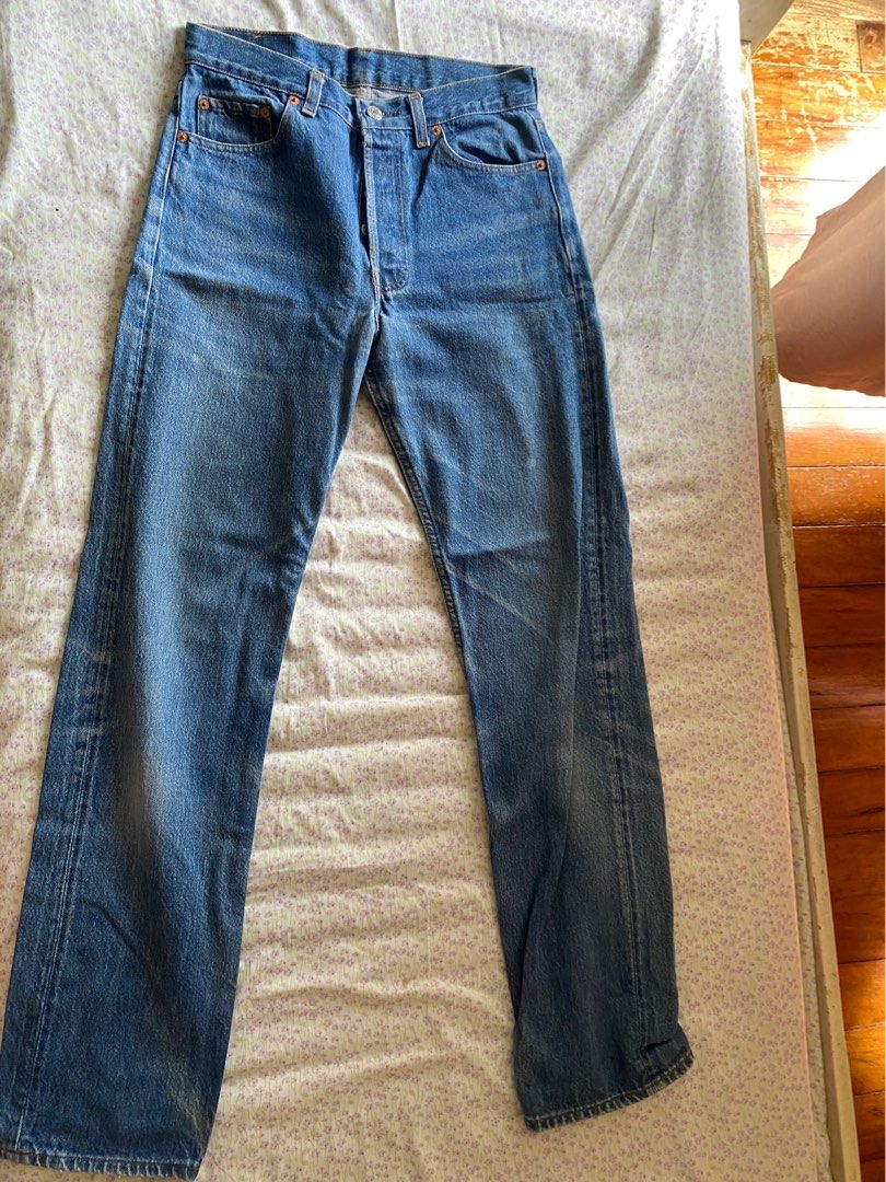 Levi's Straight Leg Denim Jeans Blue (Category: Jeans) located in Quezon City. Submitted by damclothings.ph (Listing ID 1470954283, Image 1). Description: - Brand: Levi's - Wash: Mid-wash blue with natural fading - Fit: Classic straight leg - Closure: Button fly - Details: Tan leather patch at back waistband, standard rear pockets - Material: Durable cotton fabric - Condition/Vibe: alter on the other leg.