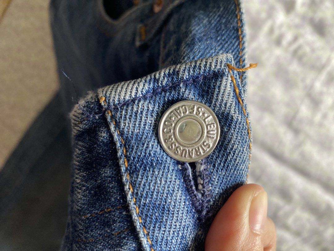 Levi's Straight Leg Denim Jeans Blue (Category: Jeans) located in Quezon City. Submitted by damclothings.ph (Listing ID 1470954283, Image 3). Description: - Brand: Levi's - Wash: Mid-wash blue with natural fading - Fit: Classic straight leg - Closure: Button fly - Details: Tan leather patch at back waistband, standard rear pockets - Material: Durable cotton fabric - Condition/Vibe: alter on the other leg.