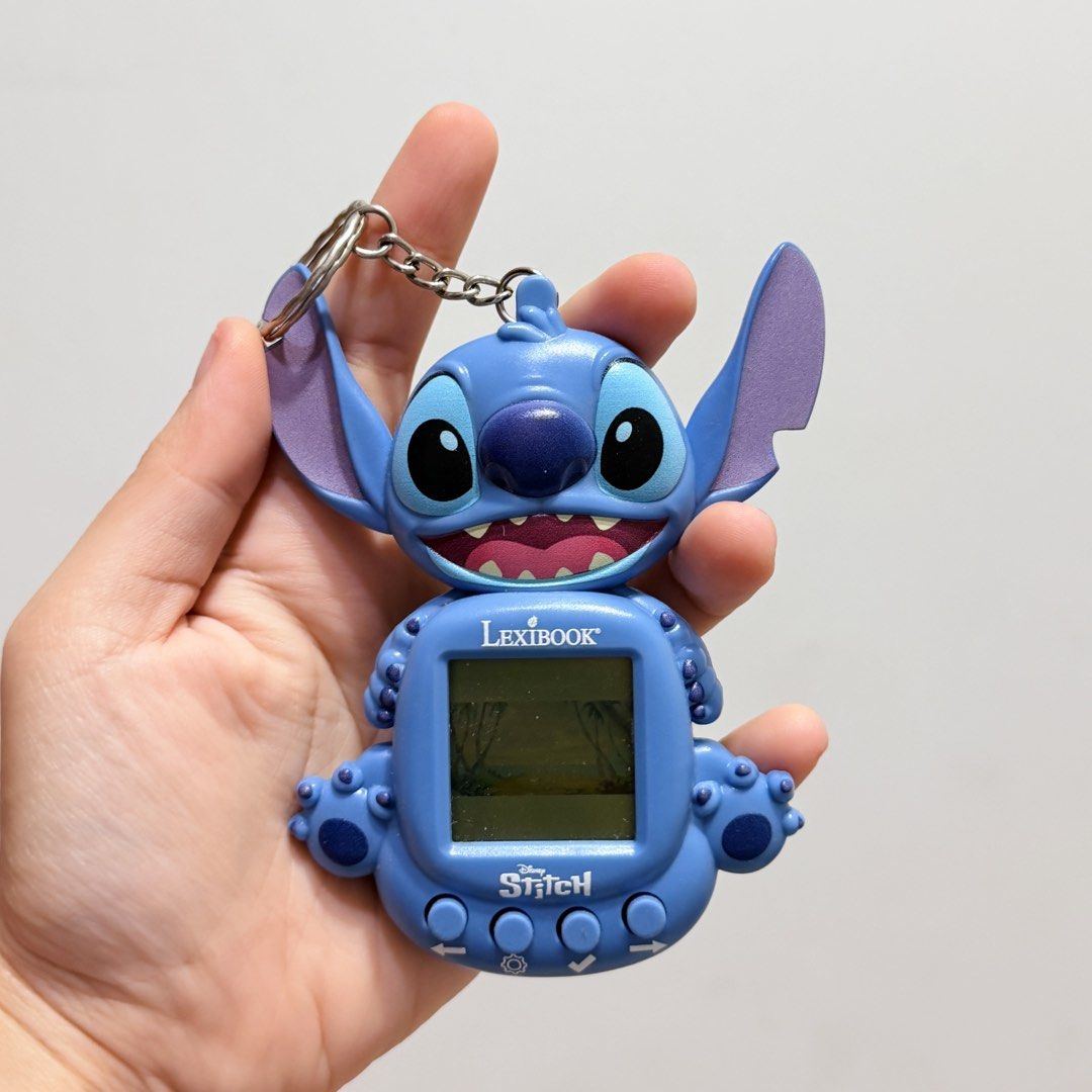 Stitching Magazines Lexibook Disney Stitch Electronic Virtual Pet Tamagotchi Keychain, Toys ...