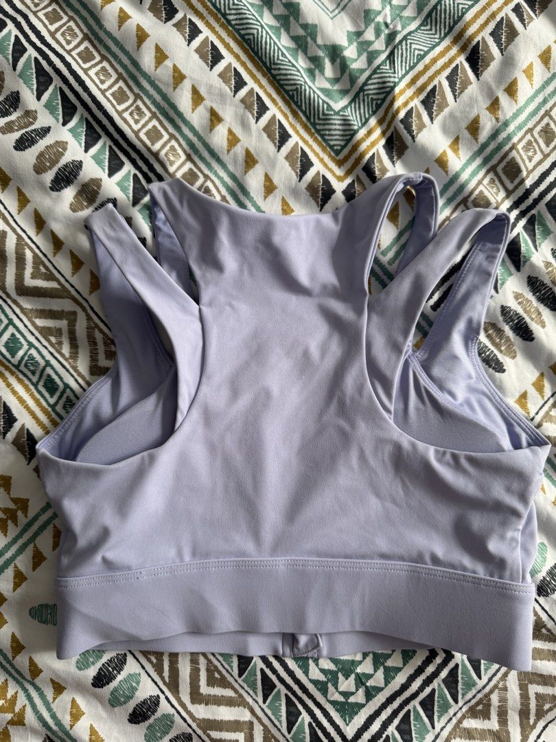 Light Purple Front Zip Sports Bra (Category: Activewear) located in Manila. Submitted by decluterthings888 (Listing ID 1470948009, Image 2). Description: - Color: Light purple XX NO BRAND XXX - Closure: Convenient front zipper (easy to wear and remove) - Design: Stylish racerback with double-strap detailing - Support: Wide underbust band for a secure fit - Comfort: Made with breathable fabric ideal for active workouts.