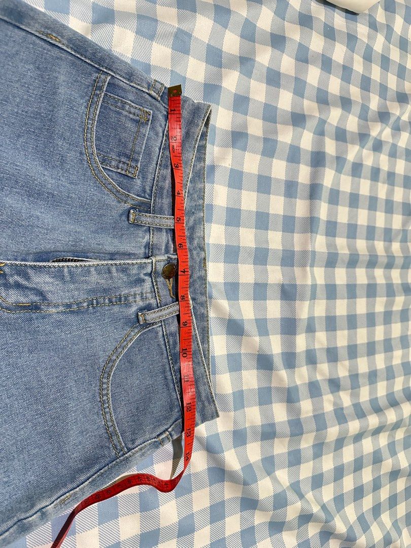 Light wash high waist denim jeans (Category: Jeans) located in Mandaluyong City. Submitted by brightbird-5701 (Listing ID 1471063485, Image 2). Description: - Color: Light wash blue - Fit: High waist - Waist measurement: Approx. 13 inches across (flat) - Closure: Front button and zipper fly - Design: Standard five-pocket style - Style: Great everyday basic, easy to match with tees and crop tops.