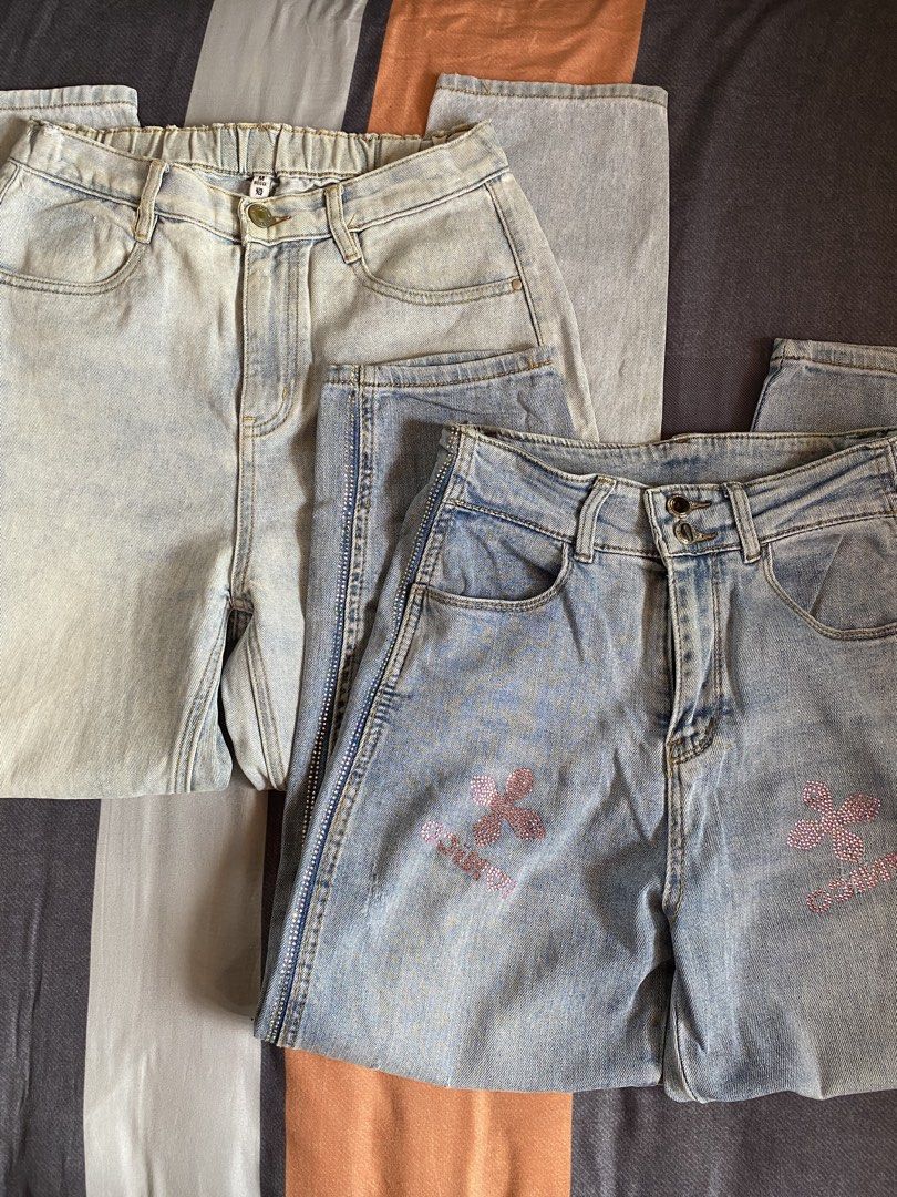 Light Wash Jeans Bundle (Category: Jeans) located in Manila. Submitted by heyheyruok (Listing ID 1470963699, Image 1). Description: - Bundle includes: 2 pairs of light wash denim jeans - Pair 1: Sparkly rhinestone clover graphics, side rhinestones, button fly closure, and slight distressing - Pair 2: Comfortable elastic waistband, standard pockets, size Medium tag inside - Style: Easy to pair with casual tees or crop tops for everyday wear - Reas