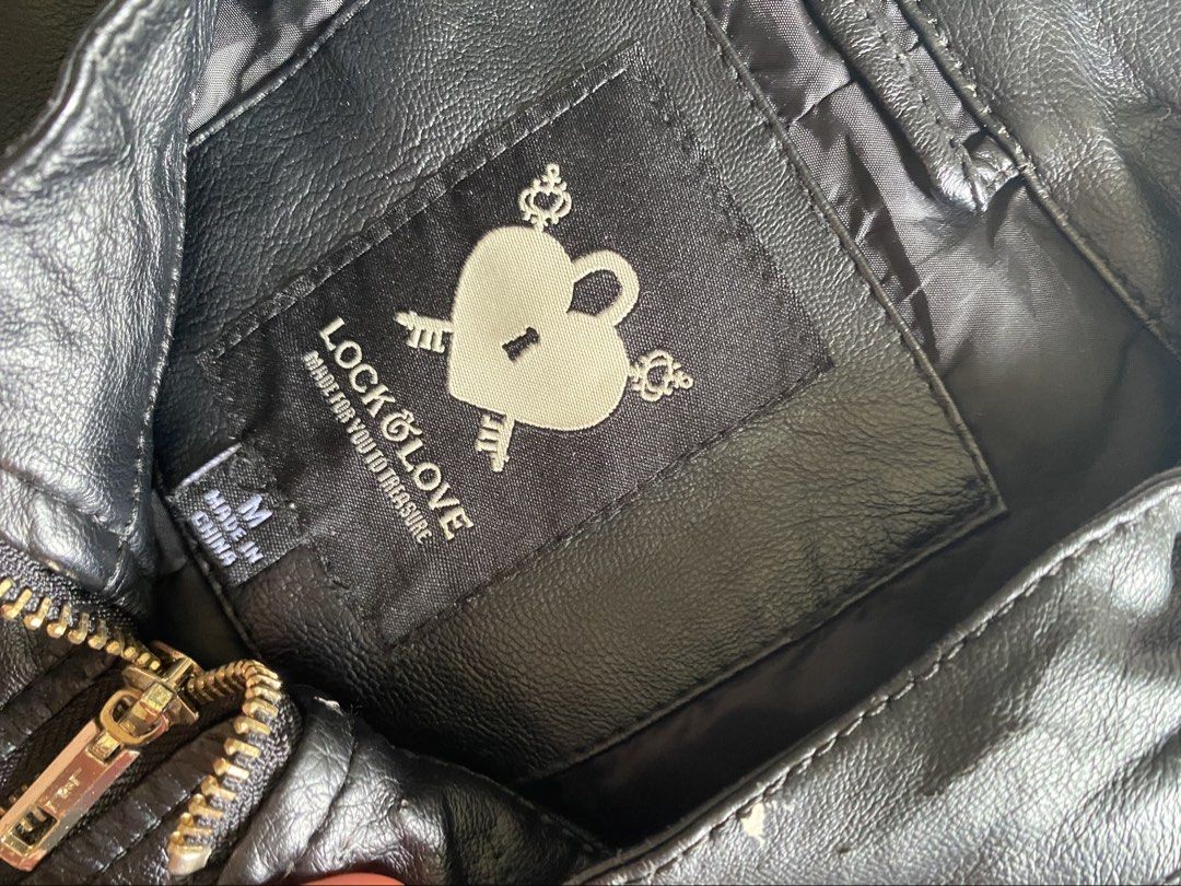 Lock & Love Faux Leather Biker Jacket Size M (Category: Coats, Jackets and Outerwear) located in Quezon City. Submitted by damclothings.ph (Listing ID 1470954013, Image 2). Description: - Brand/Model: Lock & Love Black Fux Leather Moto Jacket - Size: Medium (M) - Features: Front zipper closure, zipped chest and side pockets, quilted shoulder and side panel details - Condition: Significant flaking and peeling on the shoulder area and inner lining 