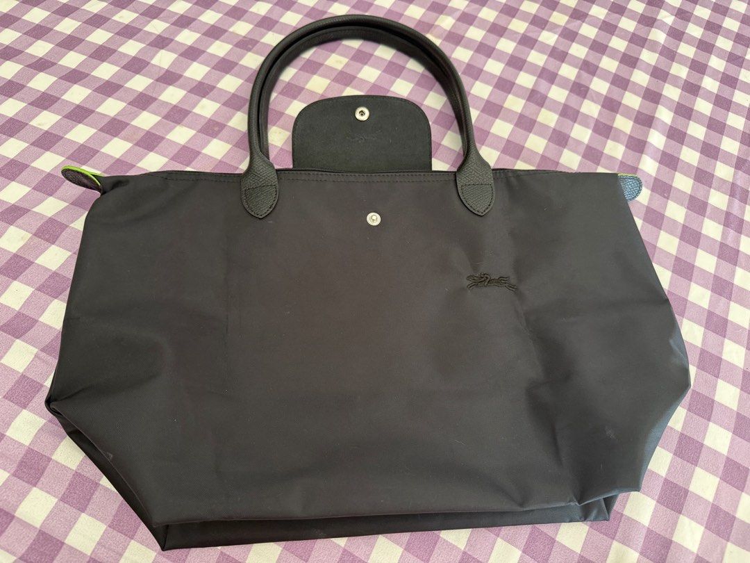 Long champ large long handle (Category: Tote Bags) located in Cavite. Submitted by itscarriegirl (Listing ID 1470986463, Image 2). Description: Auth not guaranteed thats why im selling it in a low price Self authenticate Bought this from a japan source store Dm for more deets and photos LLH greenseries black color.