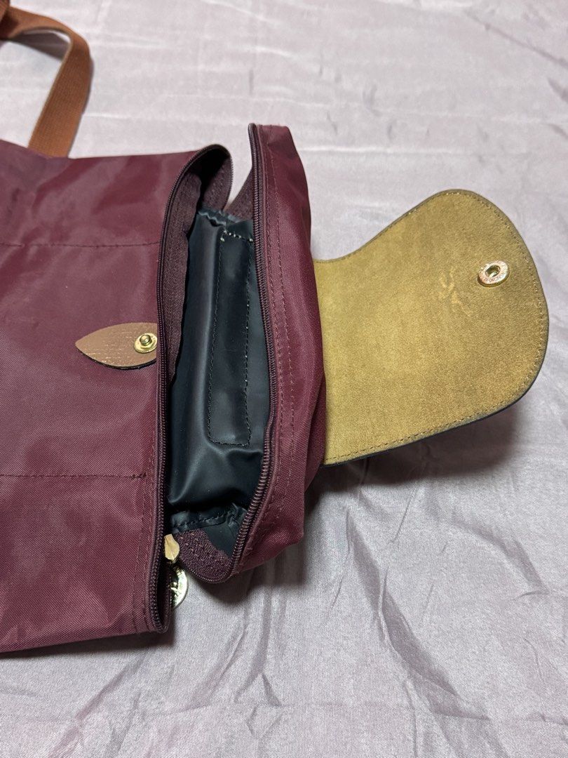 Longchamp Le Pliage Backpack (Category: Luxury Bags & Wallets) located in Quezon City. Submitted by meecaisawesome (Listing ID 1471006242, Image 3). Description: Negotiable for sure buyers! - Dirty bag flap but washable.