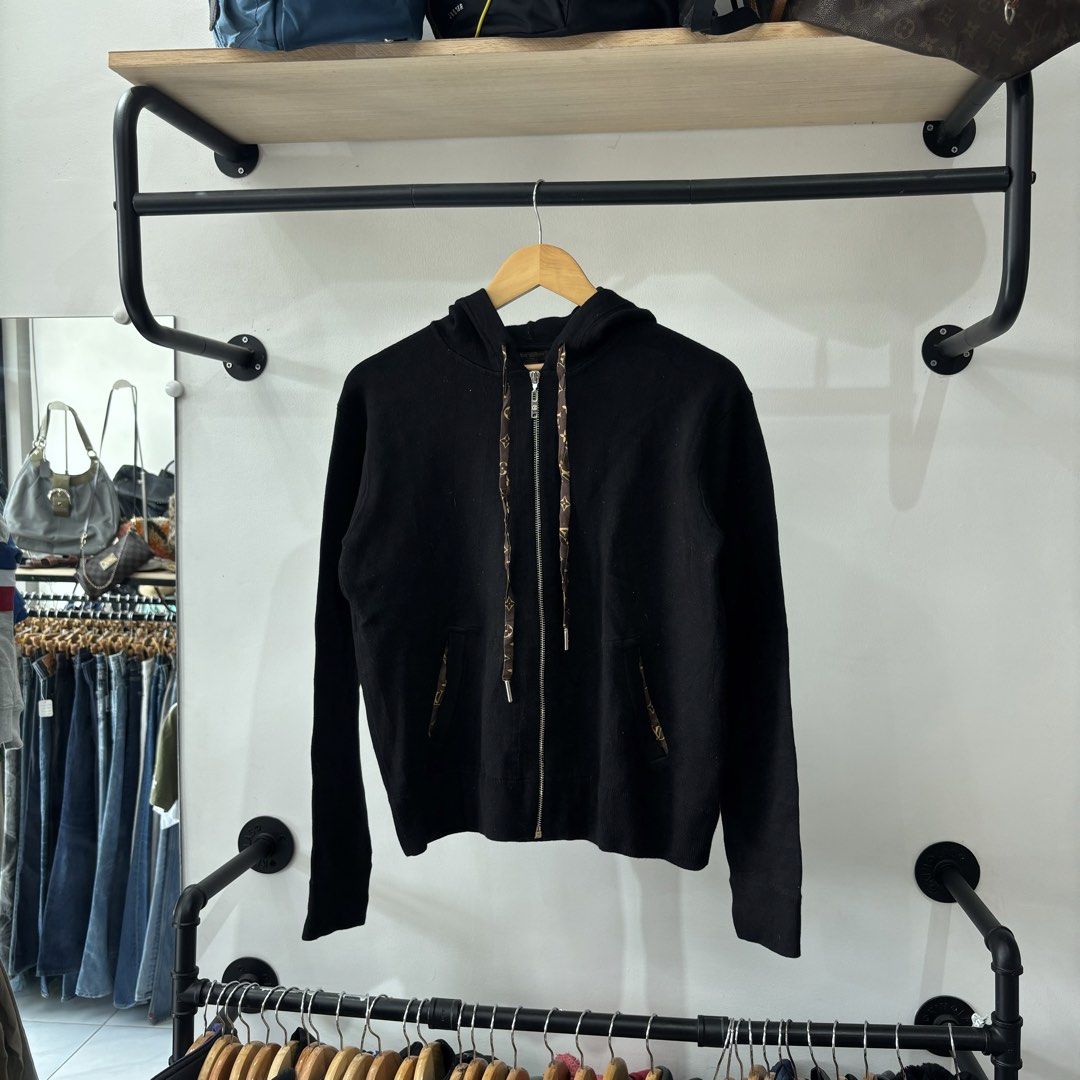 Louis Vuitton Black Monogram Drawstring Zip Hoodie (Category: Hoodies) located in Bambang. Submitted by heats777 (Listing ID 1471039452, Image 2). Description: - Brand: Louis Vuitton - Item: Black Zip Hoodie - Size: M (Regular fit) - Origin: Made in Italy - Details: Iconic LV monogram pattern on drawstrings and pocket trims - Features: Full front zip closure, dual side pockets, ribbed cuffs and hem - Condition: Excellent/Worn with care - Style: C
