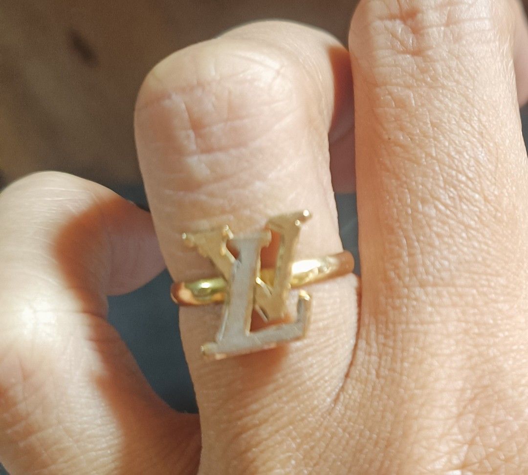 Louis Vuitton LV Logo 18k Gold Ring Pawnable (Category: Rings) located in Cebu City. Submitted by elen30abalo (Listing ID 1470954486, Image 2). Description: - money back guaranteed - Gold ring with iconic LV initials - Thin, comfortable band design - Perfect statement accessory for daily wear or going out - Minimalist look with classic branding - No box included.