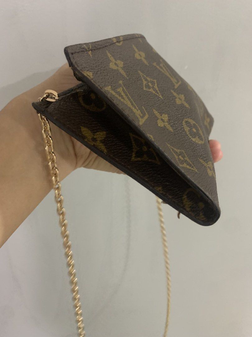 Louis Vuitton Monogram Canvas Toiletry Pouch With Chain (Category: Luxury Bags & Wallets) located in Butuan. Submitted by stuffsavenue (Listing ID 1470960577, Image 3). Description: - Authentic Louis Vuitton Monogram canvas pouch - Includes a stylish gold-tone chain strap ( i bought separately) - Classic brown LV monogram pattern throughout - Secure top zip closure with leather pull tab (heat-stamped Louis Vuitton Paris Made in France) - changes 