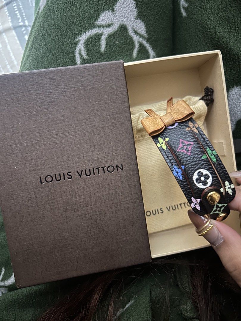 Louis Vuitton Monogram Multicolor (Category: Luxury Accessories) located in Cavite. Submitted by zacharyyy__ (Listing ID 1471059451, Image 1). Description: - Authentic Louis Vuitton Address Wish Bracelet - Classic black canvas with vibrant multicolor monogram pattern - Charming tan leather bow detail and gold-tone hardware - Adjustable buckle fastening for a secure fit - Includes original Louis Vuitton brown box and dust bag - Stunning statement 
