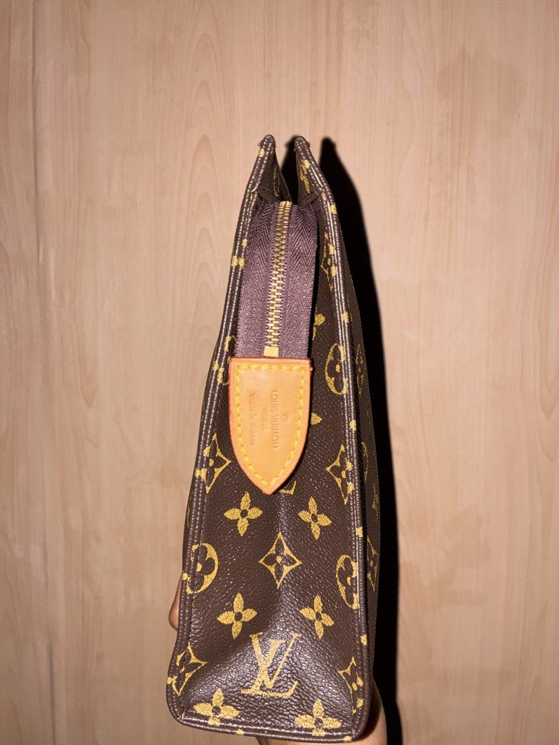 Louis Vuitton Monogram Pouch (Category: Luxury Bags & Wallets) located in Placer. Submitted by talaalond61563 (Listing ID 1471051969, Image 3). Description: - Louis Vuitton monogram canvas exterior - Secure zipper closure with leather pull tab - Stamped with Louis Vuitton Paris and Made in France - Clean light beige fabric interior lining - Generous space for daily essentials or travel items.
