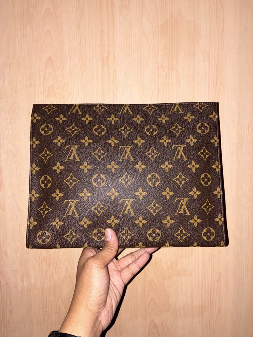 Louis Vuitton Monogram Pouch (Category: Luxury Bags & Wallets) located in Placer. Submitted by talaalond61563 (Listing ID 1471051969, Image 2). Description: - Louis Vuitton monogram canvas exterior - Secure zipper closure with leather pull tab - Stamped with Louis Vuitton Paris and Made in France - Clean light beige fabric interior lining - Generous space for daily essentials or travel items.