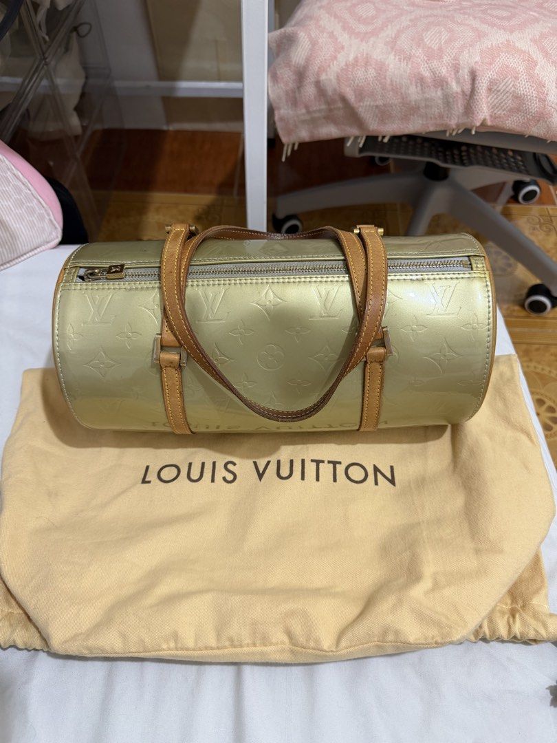 Louis Vuitton Monogram Vernis Papillon Handbag (Category: Luxury Bags & Wallets) located in Marilao. Submitted by anp129 (Listing ID 1471031271, Image 1). Description: - Brand: Louis Vuitton - Model: Monogram Vernis Papillon - Color: Green (Patent Leather) - Hardware: Gold-tone - Handles: Dual tan leather handles - Shape: Cylinder barrel shape with zip-top closure - Interior: Blue lining (Note: has ink marks inside the base) - Inclusion: Original