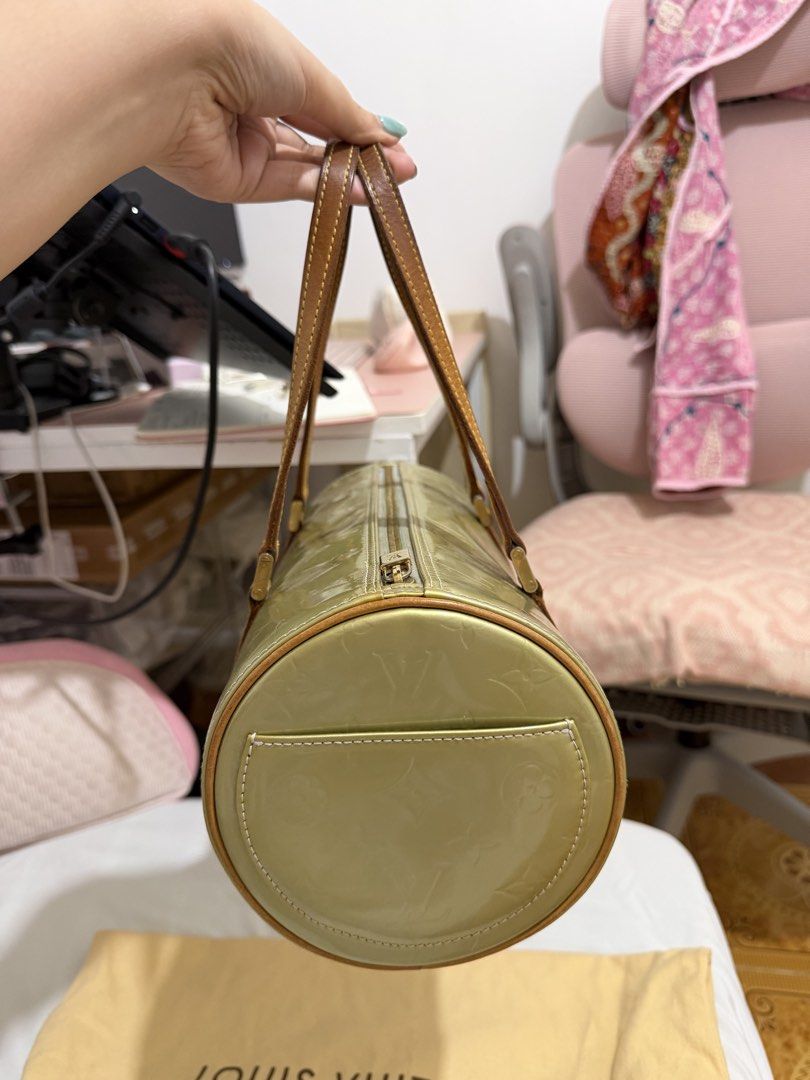 Louis Vuitton Monogram Vernis Papillon Handbag (Category: Luxury Bags & Wallets) located in Marilao. Submitted by anp129 (Listing ID 1471031271, Image 3). Description: - Brand: Louis Vuitton - Model: Monogram Vernis Papillon - Color: Green (Patent Leather) - Hardware: Gold-tone - Handles: Dual tan leather handles - Shape: Cylinder barrel shape with zip-top closure - Interior: Blue lining (Note: has ink marks inside the base) - Inclusion: Original