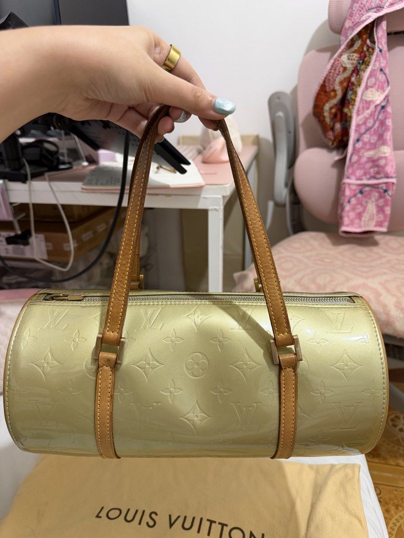 Louis Vuitton Monogram Vernis Papillon Handbag (Category: Luxury Bags & Wallets) located in Marilao. Submitted by anp129 (Listing ID 1471031271, Image 2). Description: - Brand: Louis Vuitton - Model: Monogram Vernis Papillon - Color: Green (Patent Leather) - Hardware: Gold-tone - Handles: Dual tan leather handles - Shape: Cylinder barrel shape with zip-top closure - Interior: Blue lining (Note: has ink marks inside the base) - Inclusion: Original