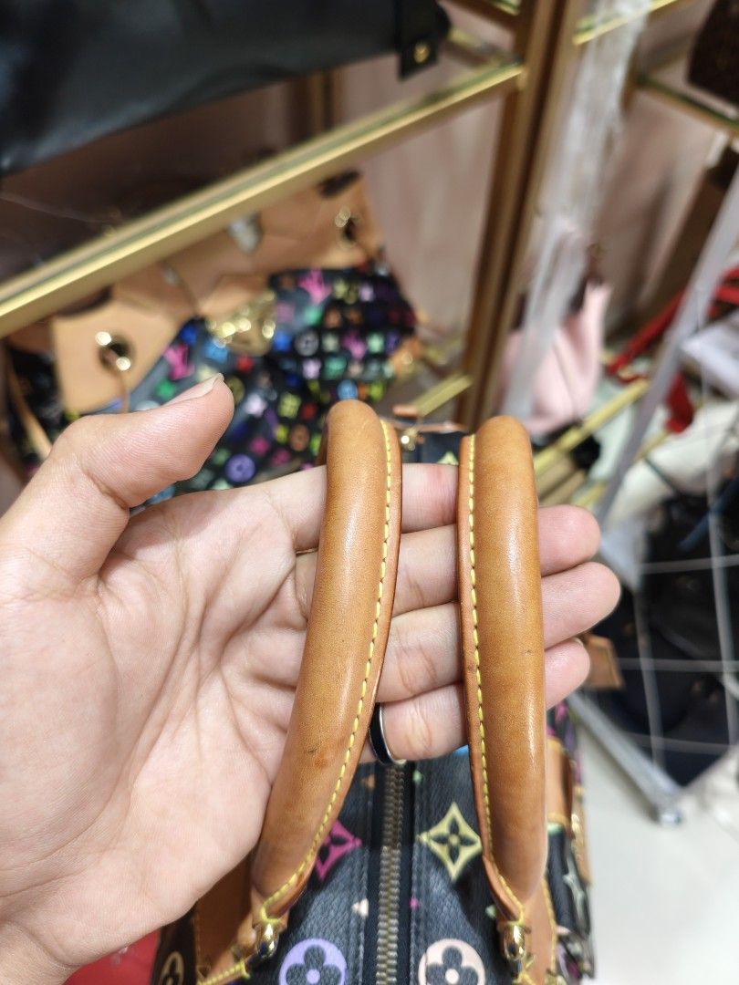 Louis Vuitton Multicolore Monogram Black Speedy Handbag (Category: Luxury Bags & Wallets) located in Quezon City. Submitted by jastine20 (Listing ID 1471100983, Image 2). Description: - Brand: Louis Vuitton - Style: Murakami Multicolore Monogram Canvas (Black) - Hardware: Gold-tone hardware, corner plates, and front pocket clasp - Handles: Rolled leather top handles with signature yellow stitching - Closure: Secure zip top closure - Design: Iconi