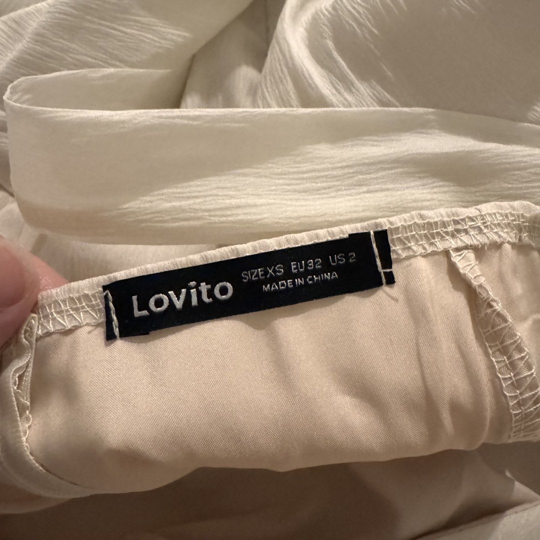 Lovito One-Shoulder Ruffle Dress (Category: Dresses) located in Manila. Submitted by shopmakii (Listing ID 1471093760, Image 3). Description: - Brand: Lovito - Style: One-shoulder asymmetric dress with layered ruffles and tie-shoulder strap - Color: Solid White - Size: XS (EU 32, US 2) - Features: Flowy tiered skirt hemline, lightweight fabric, and inner lining - Perfect for: Casual outings, dates, and summer events.