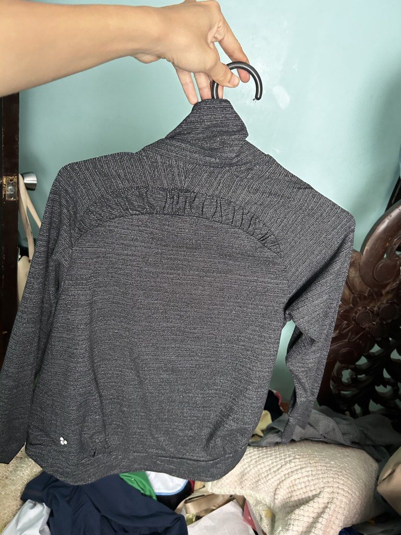 Lululemon Black Grey Blazer (Category: Coats, Jackets and Outerwear) located in Manila. Submitted by lovely.453 (Listing ID 1470961406, Image 2). Description: - Brand: Lululemon - Color/Pattern: Black and grey space dye - Style: Open front wrap with a shawl collar - Details: Ruched back yoke, cropped length, long sleeves - Fabric: Soft, stretchy performance material - Condition: Clean, well-cared for, excellent pre-loved condition - Perfect for: 