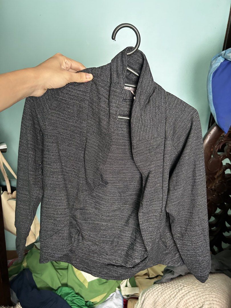 Lululemon Black Grey Blazer (Category: Coats, Jackets and Outerwear) located in Manila. Submitted by lovely.453 (Listing ID 1470961406, Image 3). Description: - Brand: Lululemon - Color/Pattern: Black and grey space dye - Style: Open front wrap with a shawl collar - Details: Ruched back yoke, cropped length, long sleeves - Fabric: Soft, stretchy performance material - Condition: Clean, well-cared for, excellent pre-loved condition - Perfect for: 