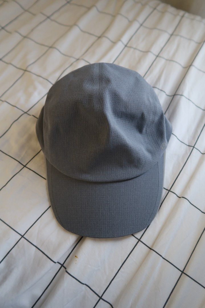 Lululemon Fast and Free Running Hat Cap S/M (Category: Caps & Hats) located in Manila. Submitted by mixi_lexi (Listing ID 1471021260, Image 2). Description: - Authentic Lululemon athletic cap in versatile grey - Textured grid pattern design - Size S/M (56 cm circumference) - Adjustable strap with secure buckle closure - Lightweight fabric with a built-in sweatband for extra comfort - Features a subtle Lululemon logo on the side - Perfect for runn