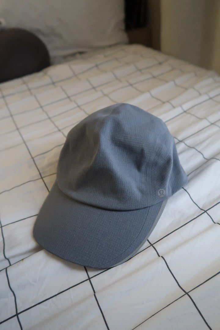 Lululemon Fast and Free Running Hat Cap S/M (Category: Caps & Hats) located in Manila. Submitted by mixi_lexi (Listing ID 1471021260, Image 1). Description: - Authentic Lululemon athletic cap in versatile grey - Textured grid pattern design - Size S/M (56 cm circumference) - Adjustable strap with secure buckle closure - Lightweight fabric with a built-in sweatband for extra comfort - Features a subtle Lululemon logo on the side - Perfect for runn
