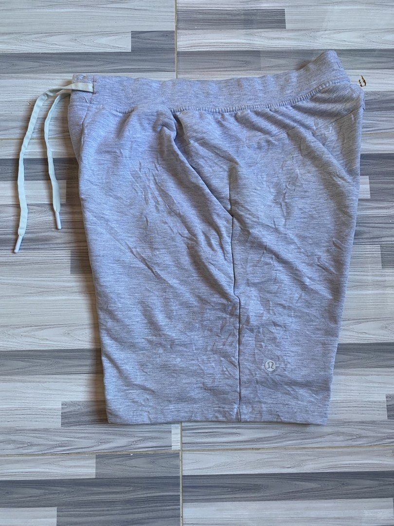 Lululemon Grey Athletic Shorts with Drawstring (Category: Shorts) located in Bayambang. Submitted by vintagestuffph (Listing ID 1471066390, Image 1). Description: - Brand: Lululemon - Color: Grey - Material: Super soft fabric for maximum comfort - Waist: Adjustable drawstring with branded tips - Storage: Convenient back zipper pocket for keys or cards - Details: Small reflective logo on the bottom left leg - Versatility: Ideal for gym workouts, r